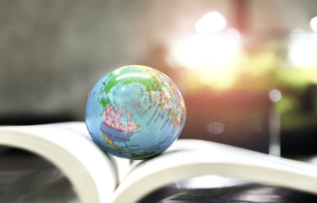 World globe on text book.    