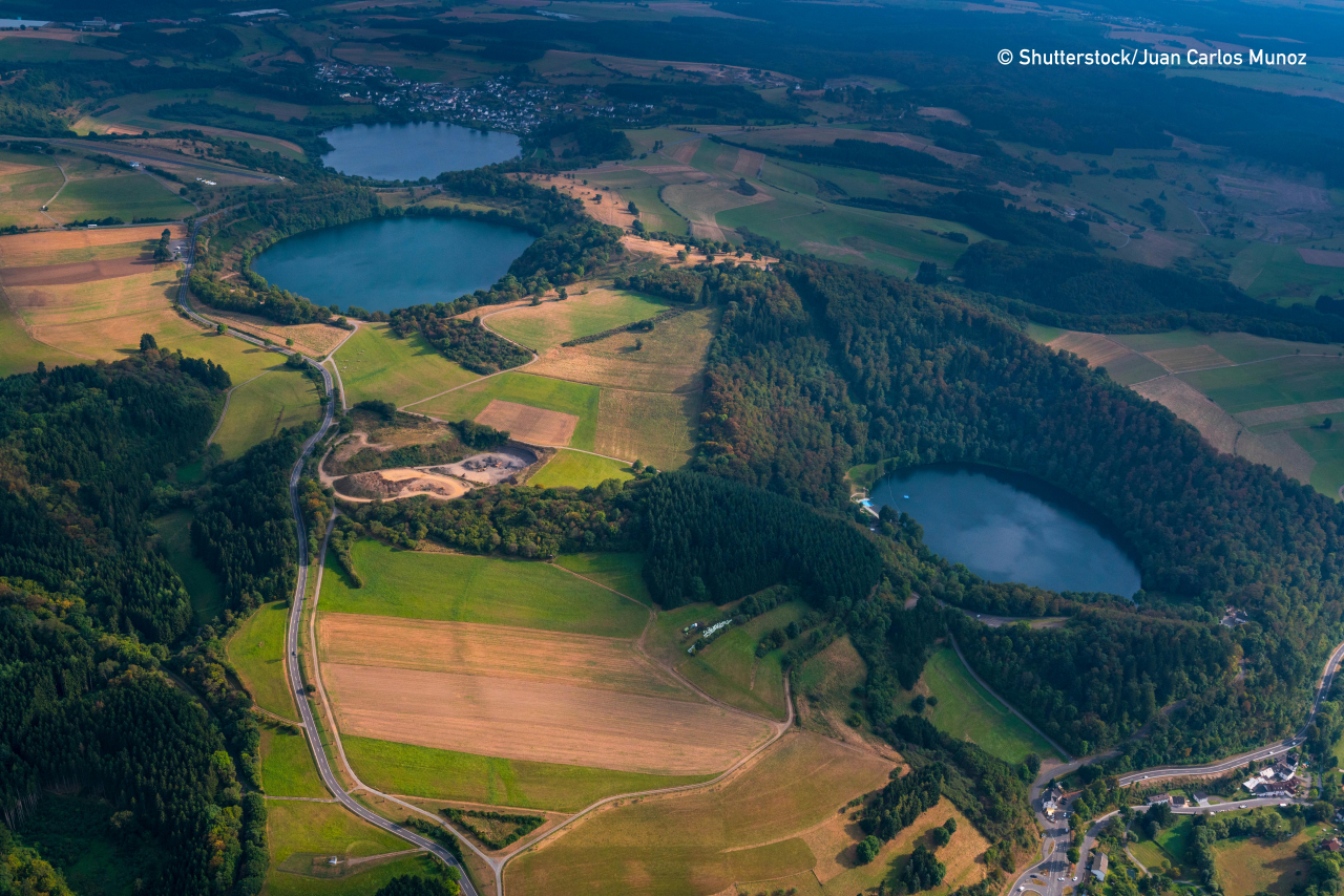 Volcanic lake or Maar in Vulkaneifel Nature Park and Geopark in Western Eifel territory of Eifel region of Germany, Europe