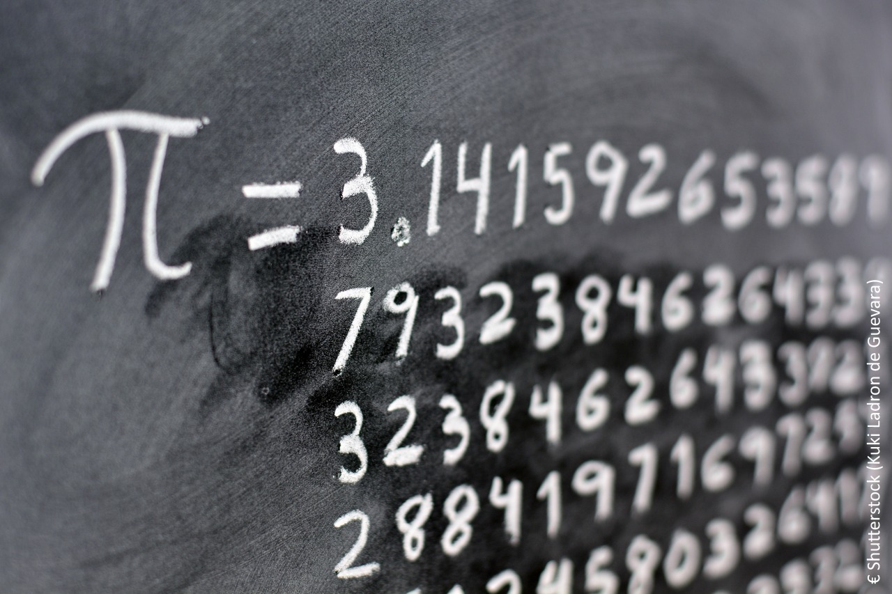 The number pi written with chalk on the blackboard, with its equivalence in numbers